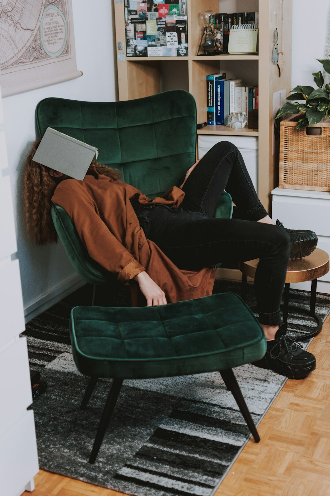 woman reading book in cozy chair